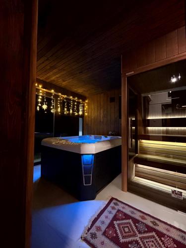 a large bathroom with a tub in a room at Wellness house Svjetlost in Jahorina