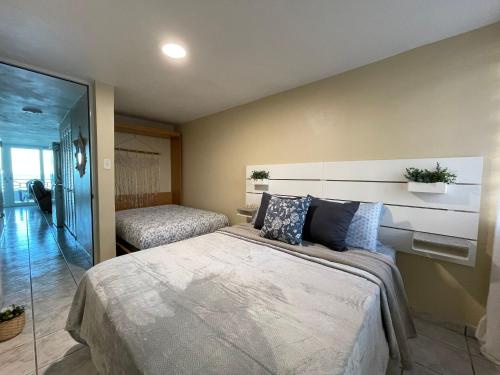 En eller flere senge i et værelse på Oceanfront Retreat in Playa Fortuna, Puerto Rico