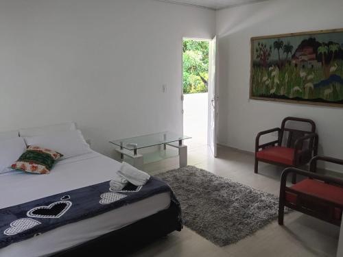 Giường trong phòng chung tại EcoHostal Tierra Prometida