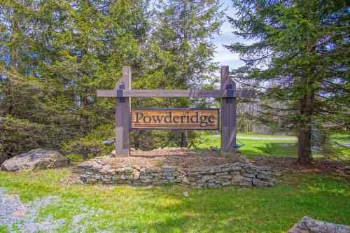 a wooden sign with a sign for a park at Powderidge 2 -Slope Side, Spacious Deck in Snowshoe