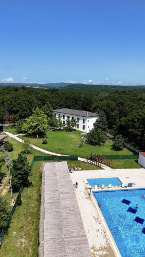 an aerial view of a swimming pool and a house at The Life Nest Hotel in Saray
