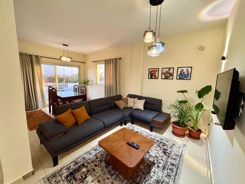 a living room with a couch and a table at Zowaar homes in Dahab