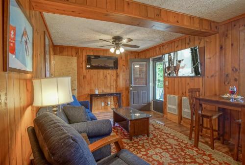 a living room with a couch and a table at Stemwinder 6B 1 Bedroom, 1 Full Bath, Slope Side in Slaty Fork