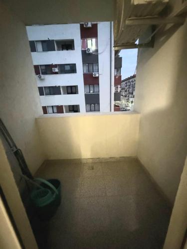 an empty room with a view of a building at Avangarde City bloc 7 in Roşu