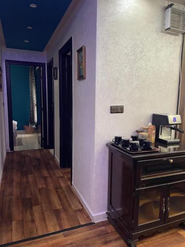 a living room with a counter with a coffee maker at Sweet appartement in Tangier