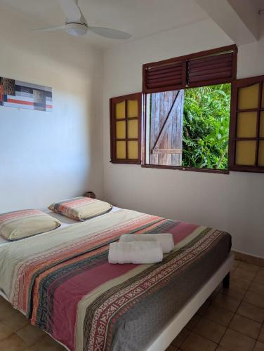 Llit o llits en una habitació de Location Hibiscus