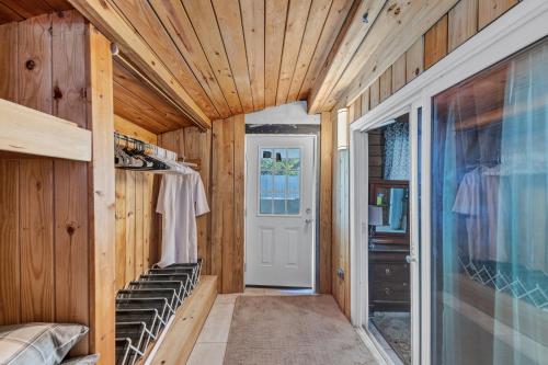 a hallway of a tiny house with a white door at Charming Atlanta Home in Atlanta