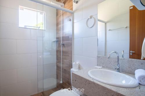 a bathroom with a sink and a shower at 2-Bedroom House with Barbecue Area WIL0012 in Imbituba