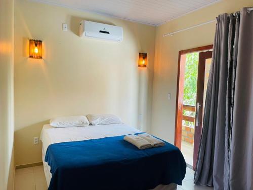 Giường trong phòng chung tại Pousada Reflexo das Águas