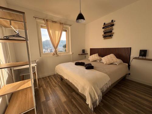 En eller flere senge i et værelse på appartement 3 chambres confortable