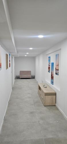 a white room with a bed and a couch in it at Alicante 30 in Alicante