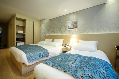 Ένα ή περισσότερα κρεβάτια σε δωμάτιο στο Hotel Sopra Incheon Cheongna