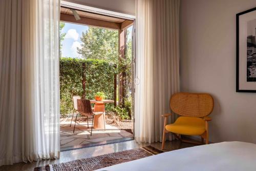 En eller flere senge i et værelse på Hotel Magdalena