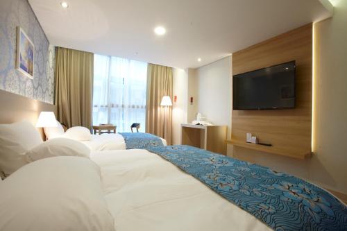 Ένα ή περισσότερα κρεβάτια σε δωμάτιο στο Hotel Sopra Incheon Cheongna