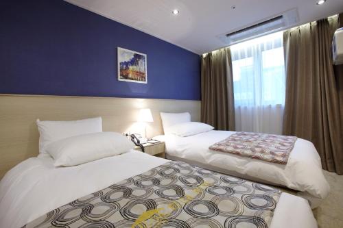 Ένα ή περισσότερα κρεβάτια σε δωμάτιο στο Hotel Sopra Incheon Cheongna