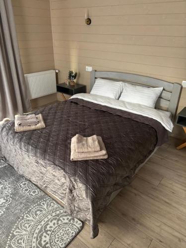 En eller flere senge i et værelse på DIM Котедж в Карпатах
