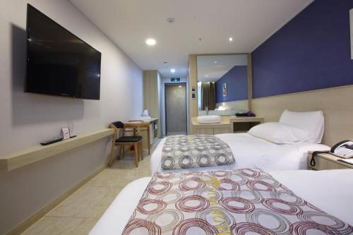 Ένα ή περισσότερα κρεβάτια σε δωμάτιο στο Hotel Sopra Incheon Cheongna