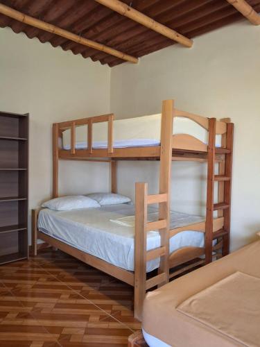 Giường trong phòng chung tại Bungalows de Chotos