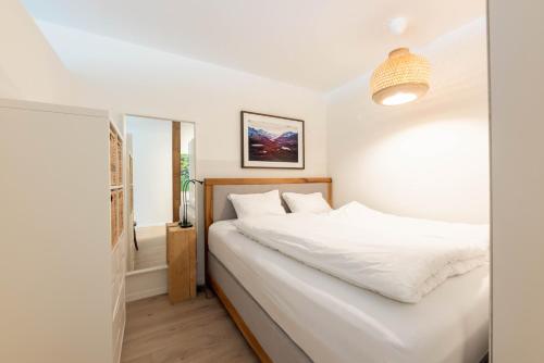 En eller flere senge i et værelse på Apartment Tinus - 3 min Walk to Ski Lift