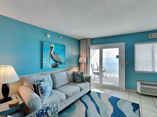 a living room with a couch and a table at Perdido Skye #54 in Perdido Key