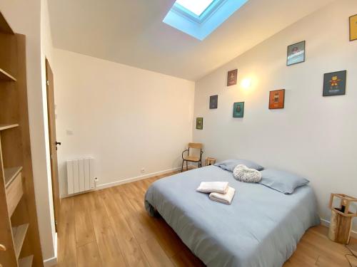 Llit o llits en una habitació de La belle Rive