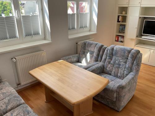 a living room with a couch and a table at Marienkirche 1 - ABC335 in Wismar