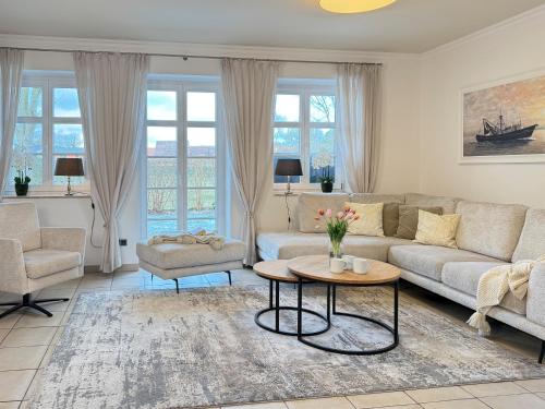 a living room with a couch and a table at Wellnessoase in Prerow