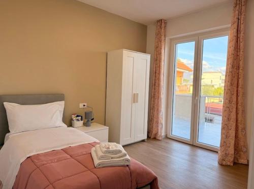 Giường trong phòng chung tại The Villas - Guest Houses