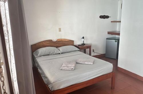 Postel nebo postele na pokoji v ubytování Hotel Marielos