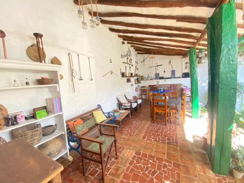 a room with chairs and a table in a room at Posada Sueños de Antonio in Barichara