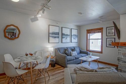 a living room with a couch and a table at Rimfire 342: Memory Maker, Walk to Shops, Slope Side in Slaty Fork