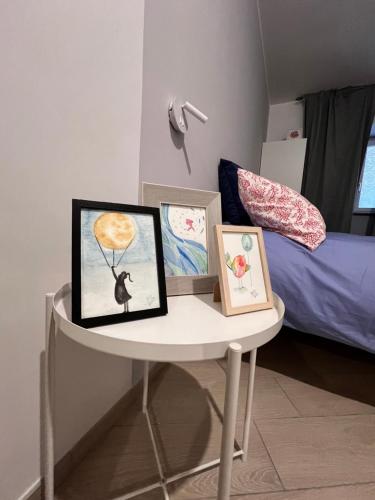 En eller flere senge i et værelse på Casa Acquarello