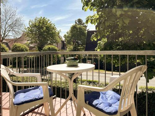 two chairs and a table on a patio at Windwatt 4 in Zingst