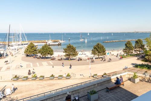 a view of a beach with people and the water at Kiel Water 4 in Schilksee