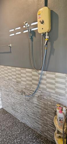 a bathroom with a shower with a toilet in it at ST house in Ban Nua Khlong