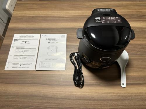 a hair dryer sitting on a table next to a receipt at Guest House "Ro"Ikura in Shimonoseki