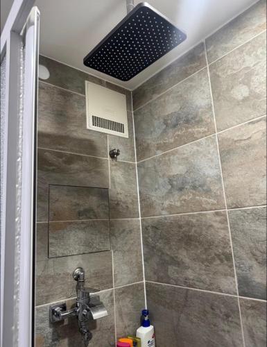 a bathroom with a shower with a ceiling at WKI Company in Mannheim