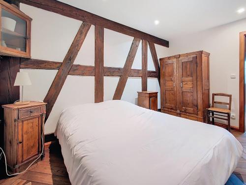 En eller flere senge i et værelse på Les Perles du Ried - Gîte 201