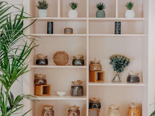 a shelf filled with plants and vases at Novotel Paris Centre Tour Eiffel in Paris
