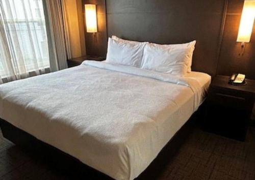 a large white bed in a hotel room at Residence Inn Paducah in Paducah