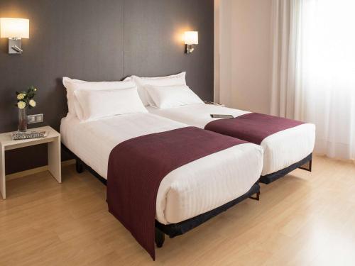 Postel nebo postele na pokoji v ubytování Augusta Barcelona Vallès