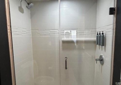 a shower with a glass door in a bathroom at Residence Inn Paducah in Paducah