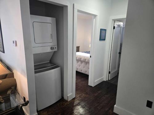 a small room with a washer and dryer at The Gratiot in Detroit