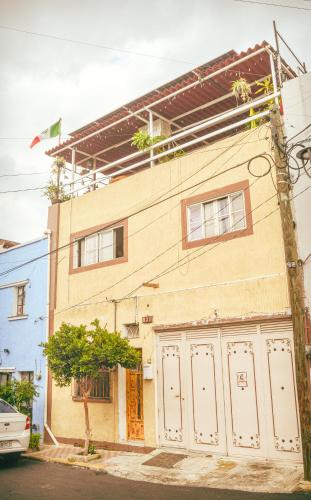 a building with white doors on the side of it at Hostal Guadalajara in Guadalajara