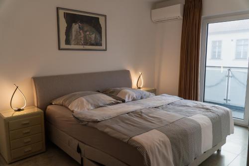 Giường trong phòng chung tại Ferienwohnungen Orchidee