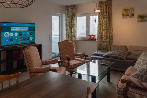 TV/trung tâm giải trí tại Ferienwohnungen Orchidee