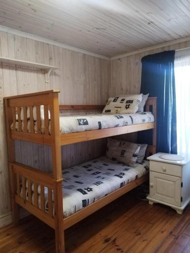 En eller flere senge i et værelse på Zen-Vibes Holiday Home