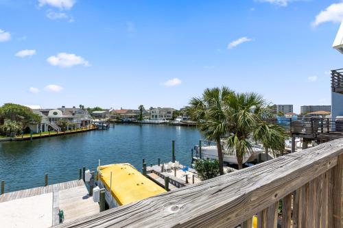 a view of a river with a yellow boat at Allendale Docks in Destin