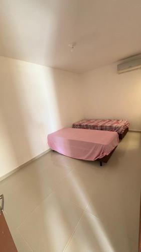 En eller flere senge i et værelse på Flat em Carapibus