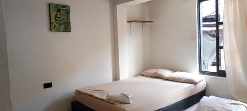 Giường trong phòng chung tại La Posada De Shaz En Norcasia